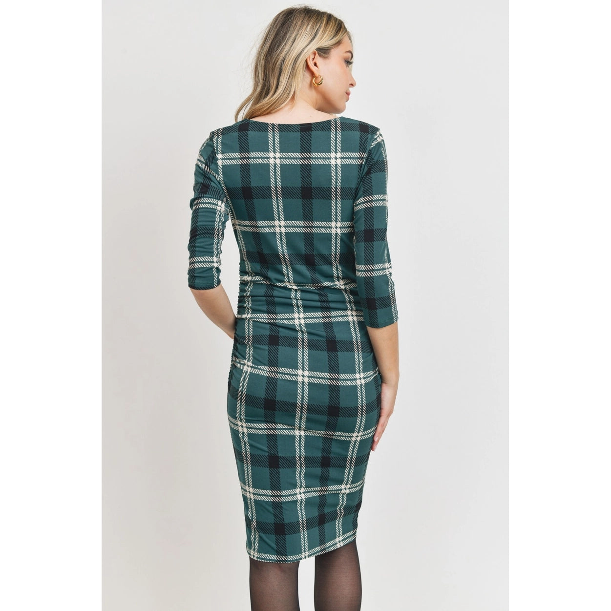 Green plaid maternity dress with ruching for a flattering silhouette.
