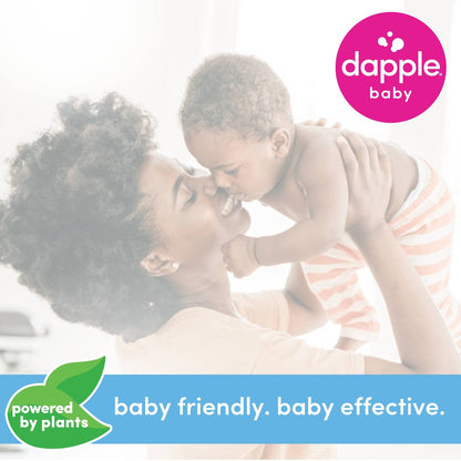 Woman holding a baby with Dapple Baby branding and 'powered by plants' label.