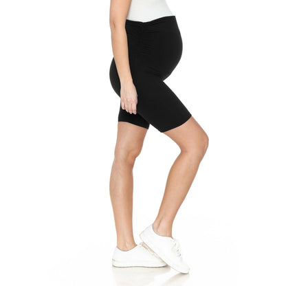 Side view of a pregnant woman in Buttery Soft Print Maternity Shorts in black.