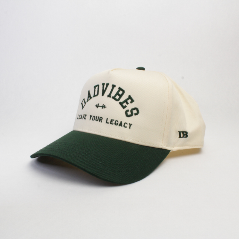 Beige and green cap with 'Bad Vibes' text on a white background