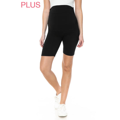 A pregnant woman in Plus Size Buttery Soft Print Maternity Shorts in the color black.