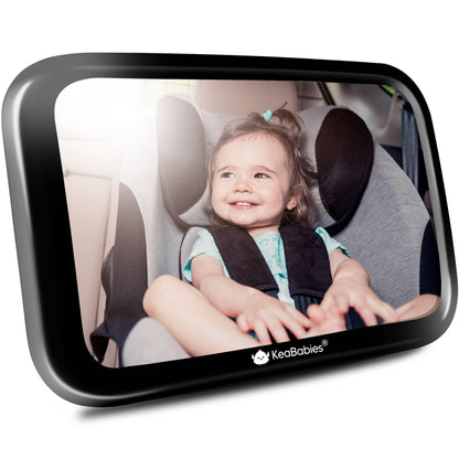 Child in a car seat with a backrest mirror showing the KeaBabies brand.