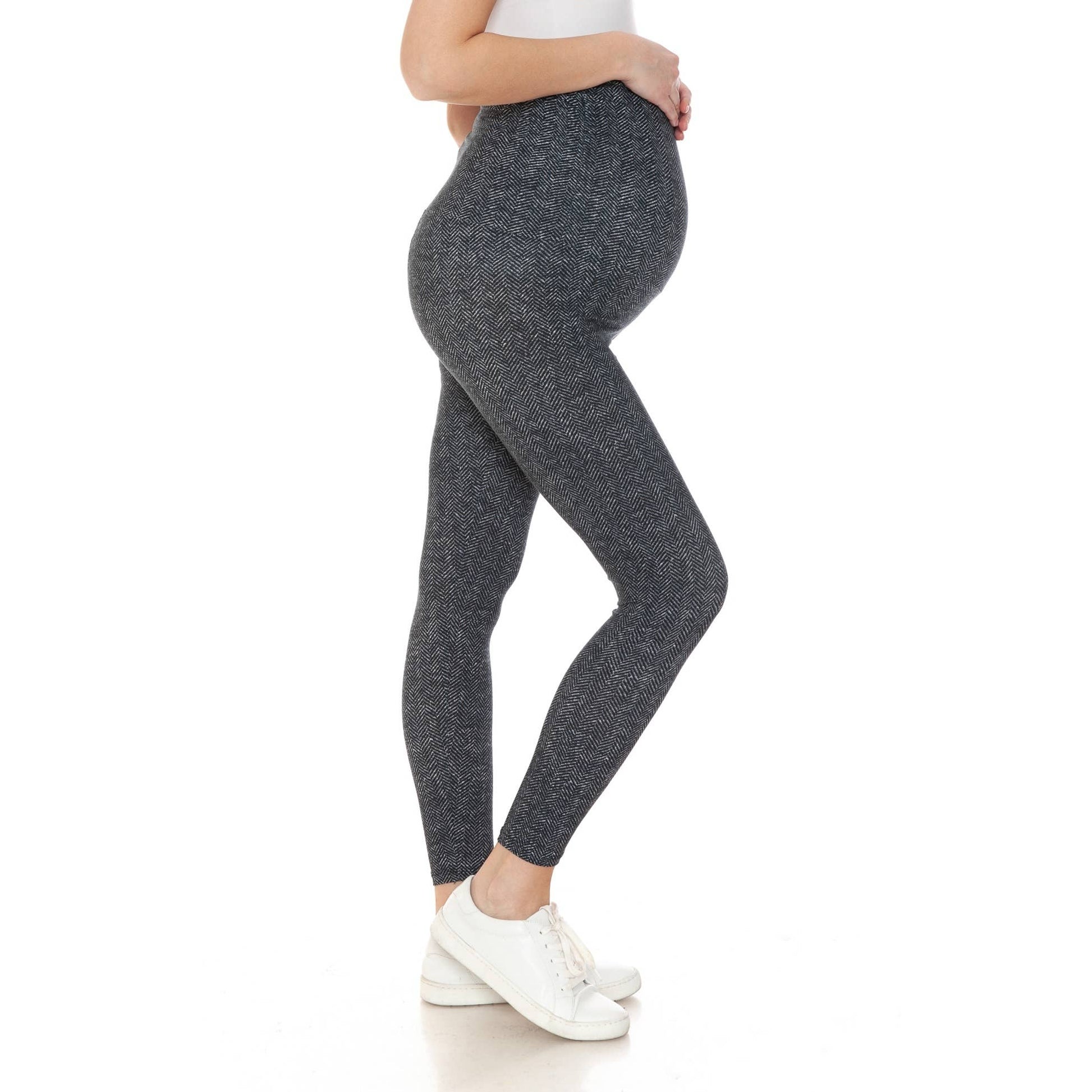 Side view of a pregnant woman wearing Buttery Soft Full Length Print Maternity Leggings in herringbone pattern.