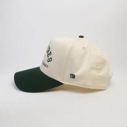 Side wiew of a green and white cap against a white background