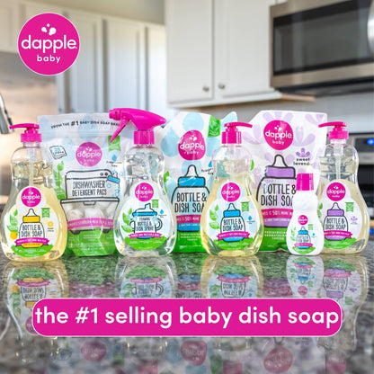 Diverse Dapple Baby product lineup on a kitchen counter with branding and text.