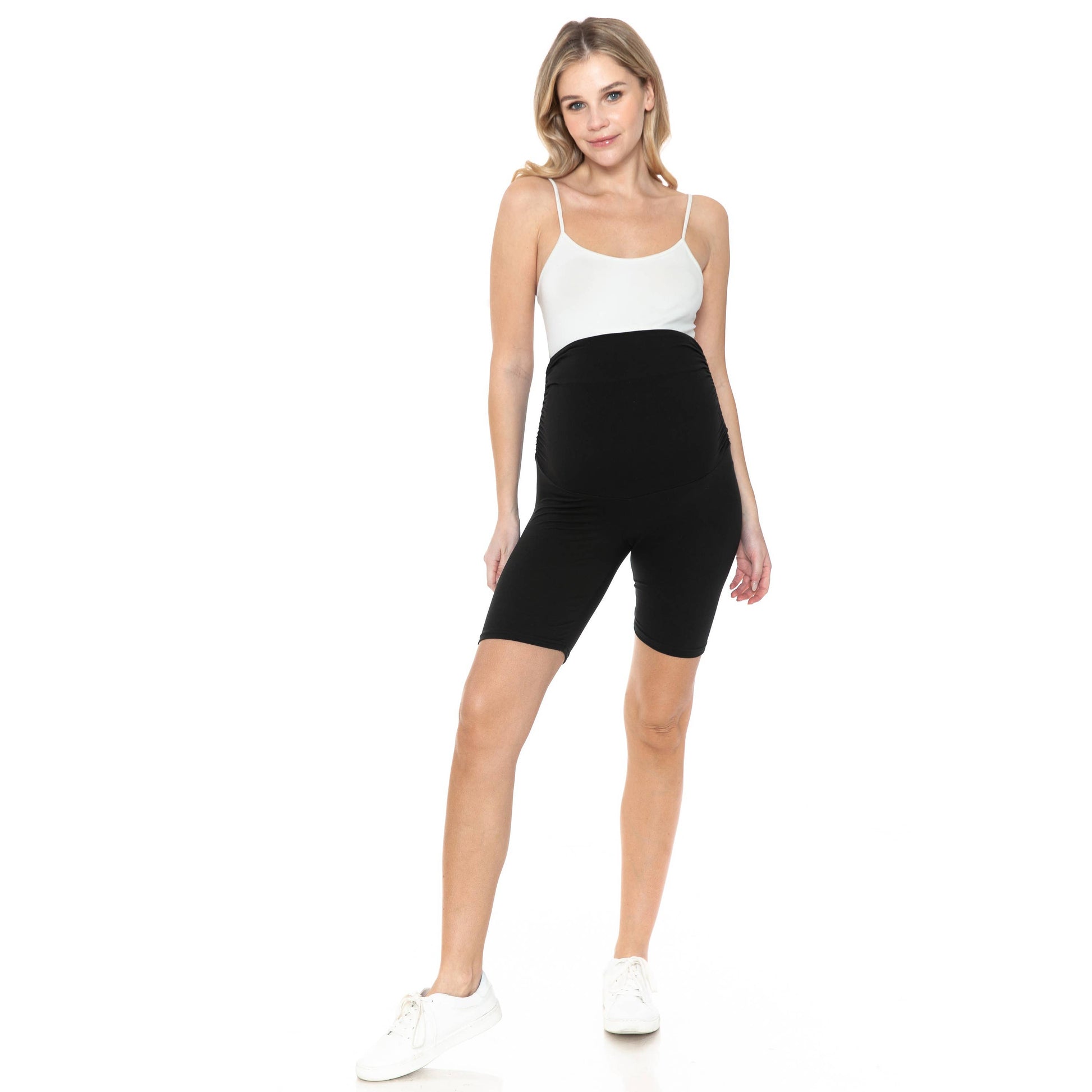 A pregnant woman in stylish Buttery Soft Print Maternity Shorts.