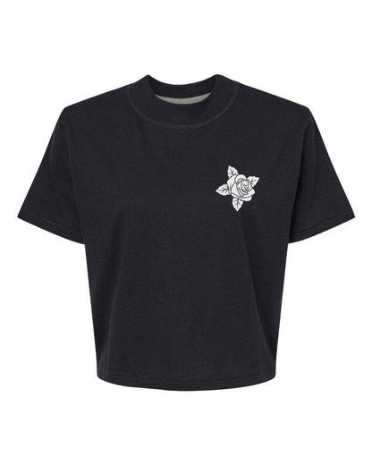 Black t-shirt with a white rose design on a white background