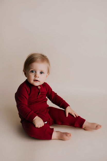Three Little Tots Ruby Red Baby Ribbed Playsuit with Pockets