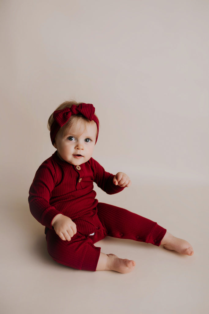 Three Little Tots Ruby Red Baby Ribbed Playsuit with Pockets