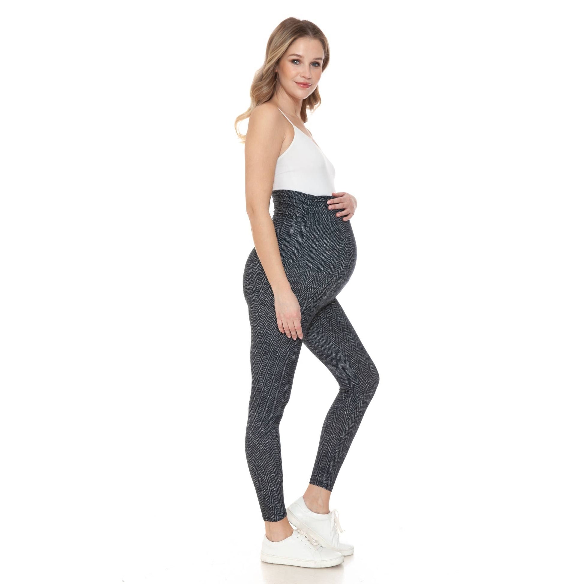 Side view of a pregnant woman wearing Buttery Soft Full Length Print Maternity Leggings in herringbone pattern.