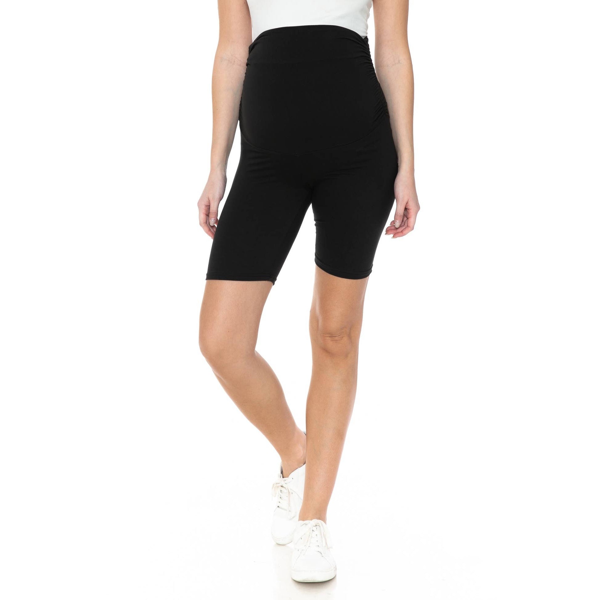 A pregnant woman in Buttery Soft Print Maternity Shorts.
